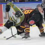 Voodoos captain Parker Bowman, left, and Timmins Rock captain Derek Seguin battle for the puck during a face-off in Friday night’s NOJHL game at the Powassan Sportsplex. The Voodoos went on to defeat the Rock 3-1 in the contest, reclaiming top spot in the NOJHL’s overall standings. It was the third-straight victory for the Voodoos over the Rock in less than a month. NOJHL NETWORK