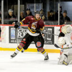 THOMAS PERRY/THE DAILY PRESS Hearst Lumberjacks goalie Nicholas Tallarico makes an acrobatic save while Timmins Rock forward Riley Brousseau attempts to get his stick on the rebound during the first period Game 6 of the NOJHL East Division best-of-seven semi-final series at the McIntyre Arena Monday night. Tallarico, the NOJHL’s regular-season MVP, wasn’t as busy as he had been earlier in the series, but he made all the saves he needed to to backstop the Lumberjacks to a 5-4 victory, tying up the series at 3-3, with Game 7 to be played at the Claude Larose Arena Wednesday night.